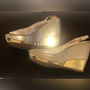 Gold platform sandals by Dune
